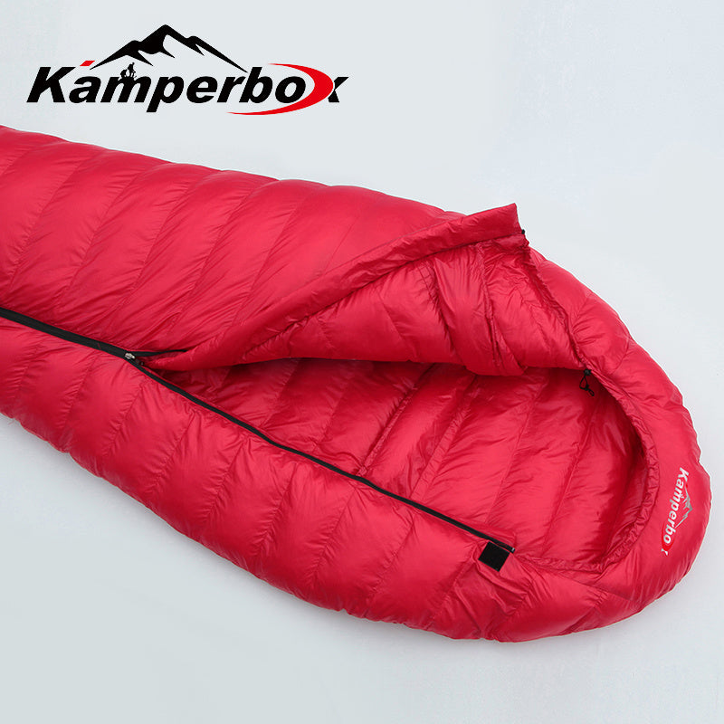 Load image into Gallery viewer, Red sleeping bag with Kamperbox logo on a light gray background
