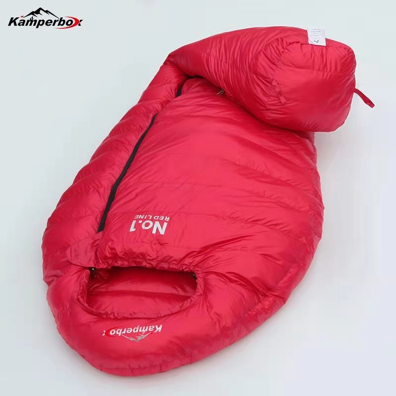 Load image into Gallery viewer, Red sleeping bag with Kamperbox branding on a white background
