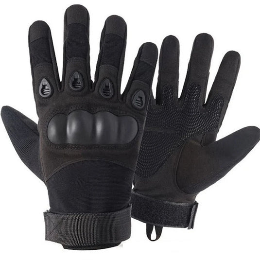 Pair of black tactical gloves on a white background