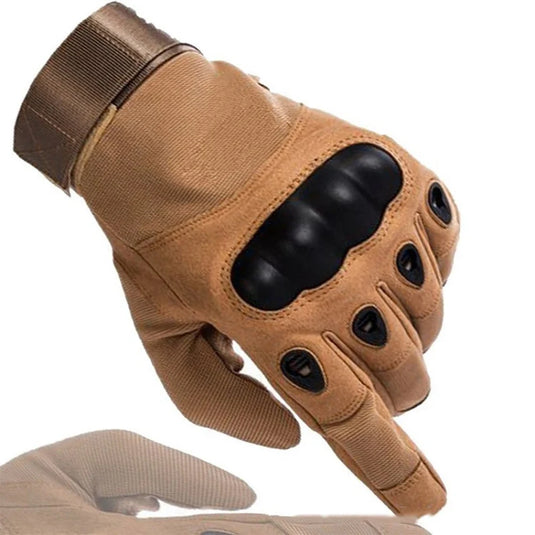 Tan tactical glove with black accents on a white background